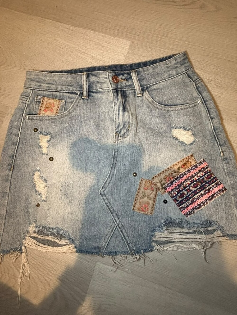 Light Wash Distressed Women’s Denim Skirts with Patch Detail